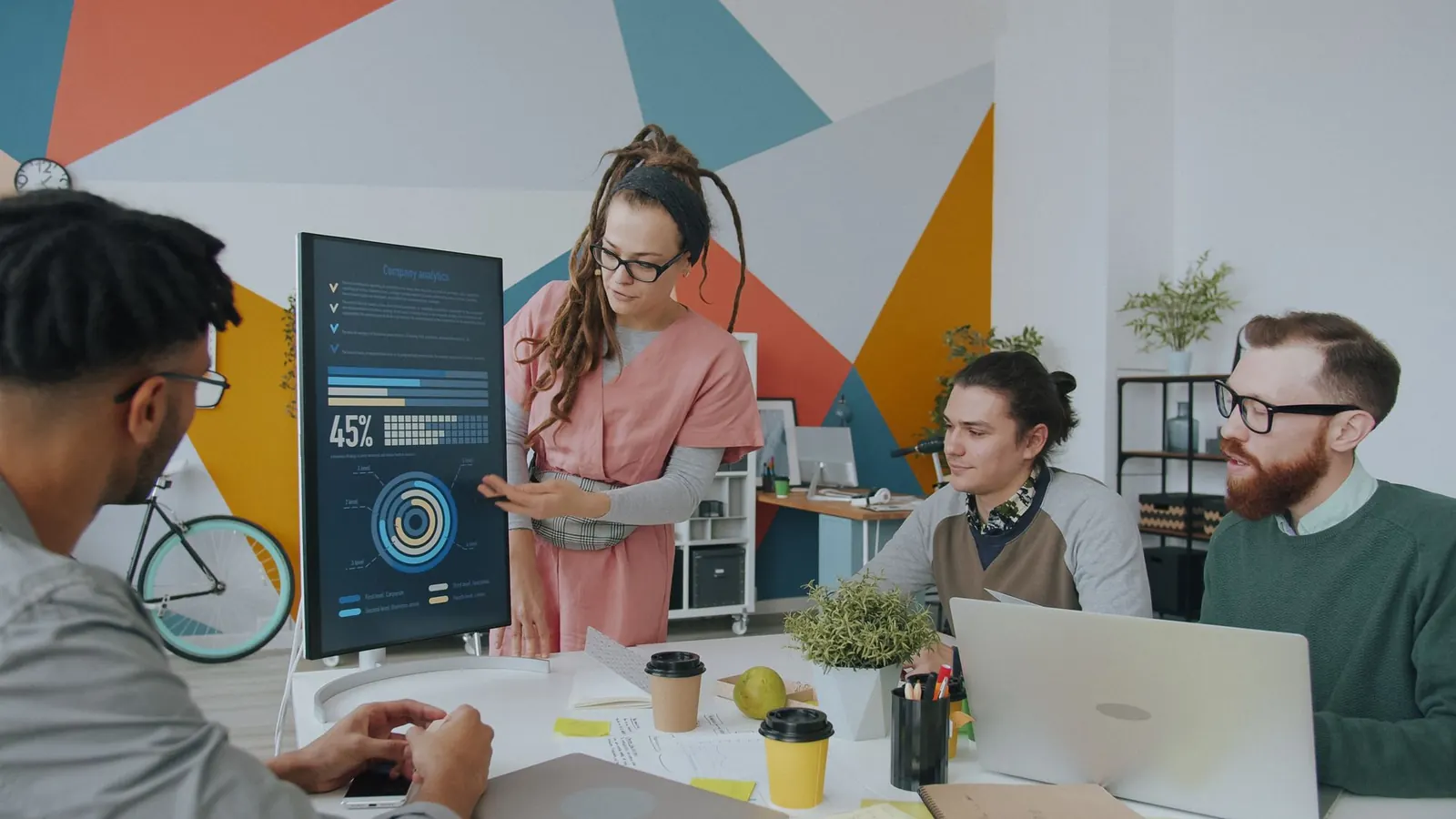 A diverse team reviewing growth charts together in a modern office
